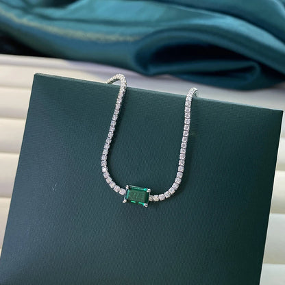 Inlaid with lab-grown emeralds, this vintage tennis bracelet is crafted from 925 sterling silver and finished with white gold plating. Available in 6.7-inch and 7.5-inch sizes